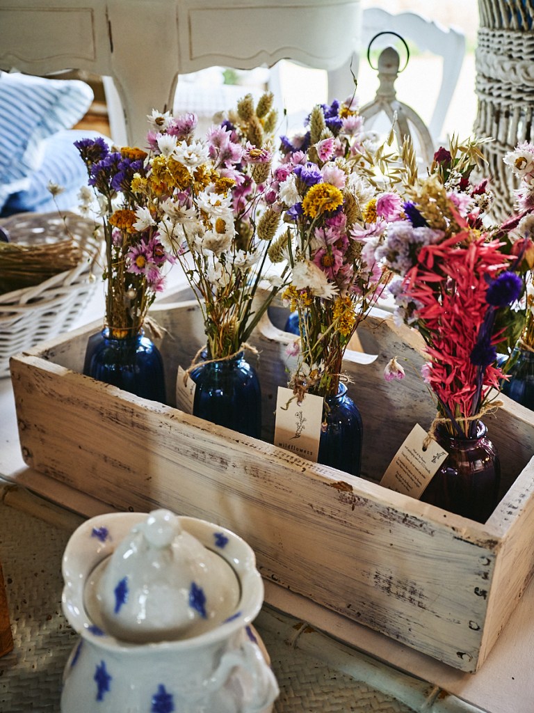 vintage furniture, clothing and items inside historic barn in Vermont