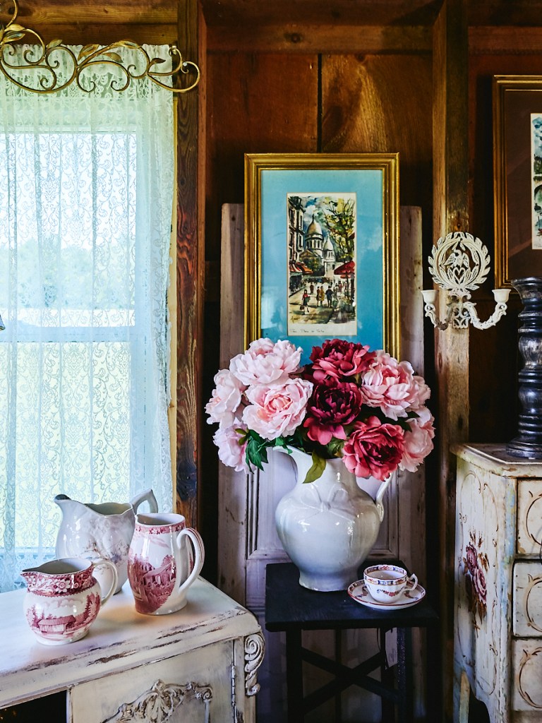 vintage furniture, clothing and items inside historic barn in Vermont