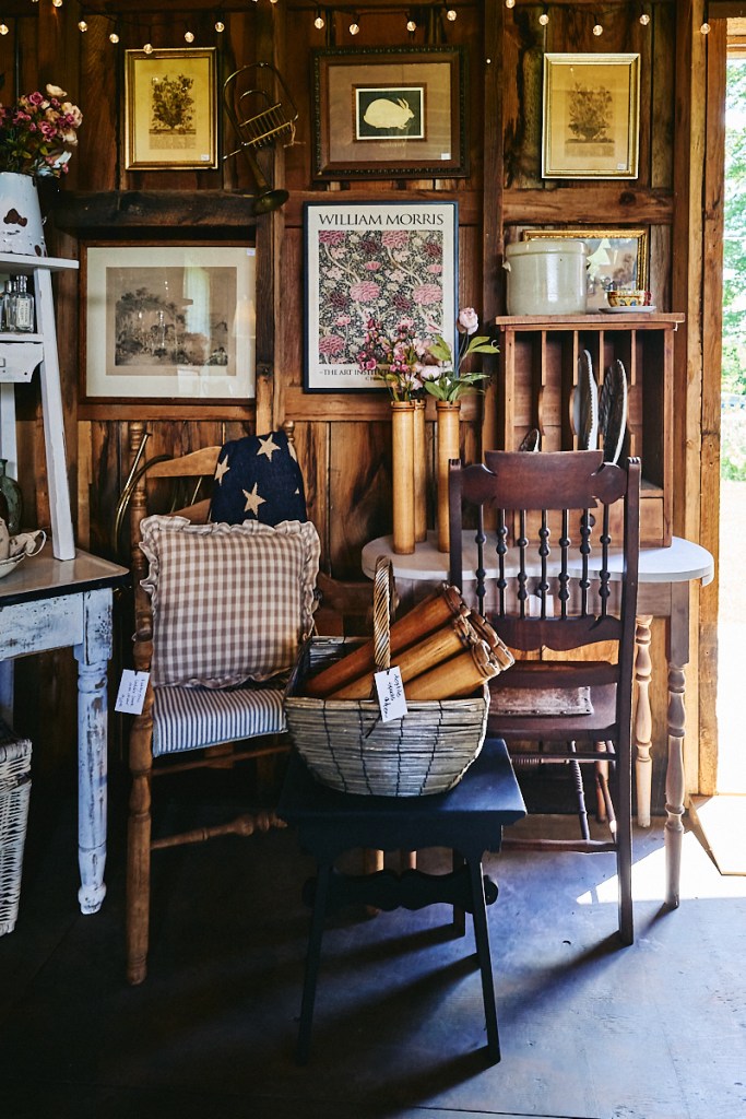vintage furniture, clothing and items inside historic barn in Vermont
